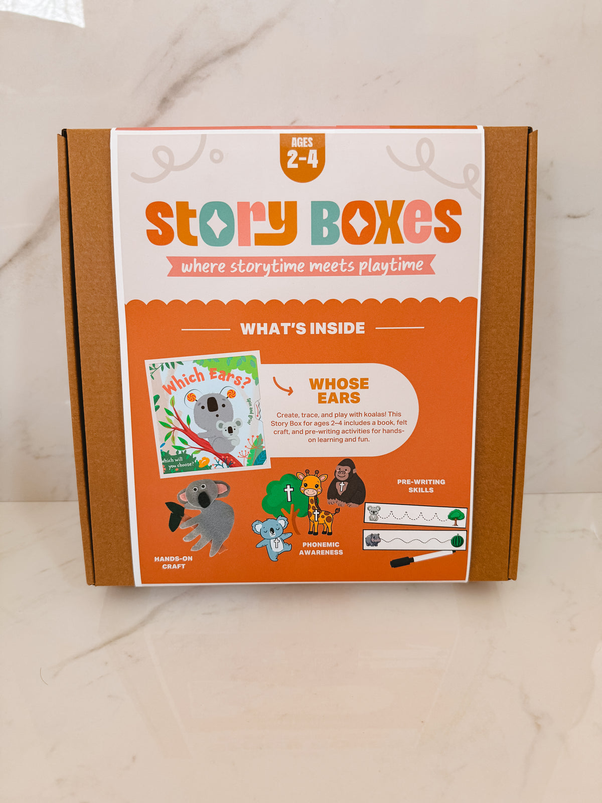 Story Boxes packaging with illustrations of animals on a beige background