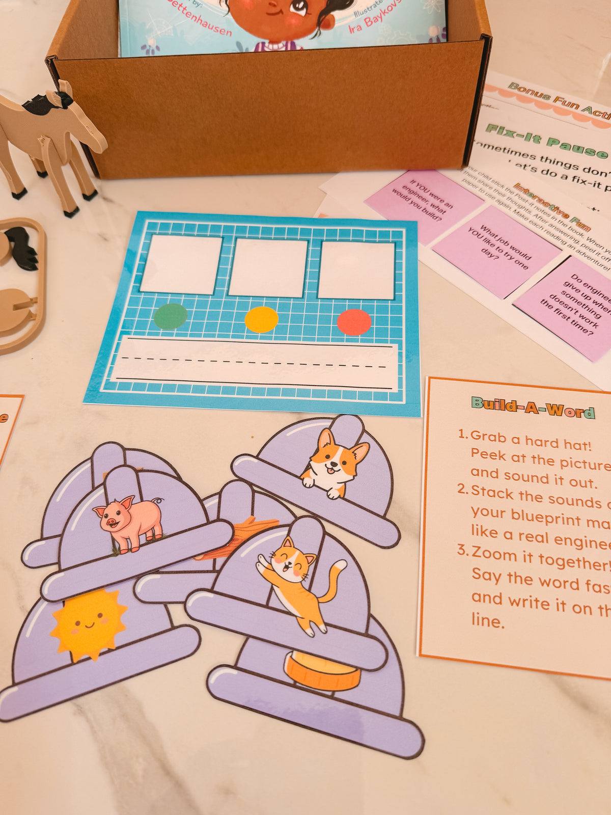 Educational materials including a worksheet and puzzle pieces on a table.