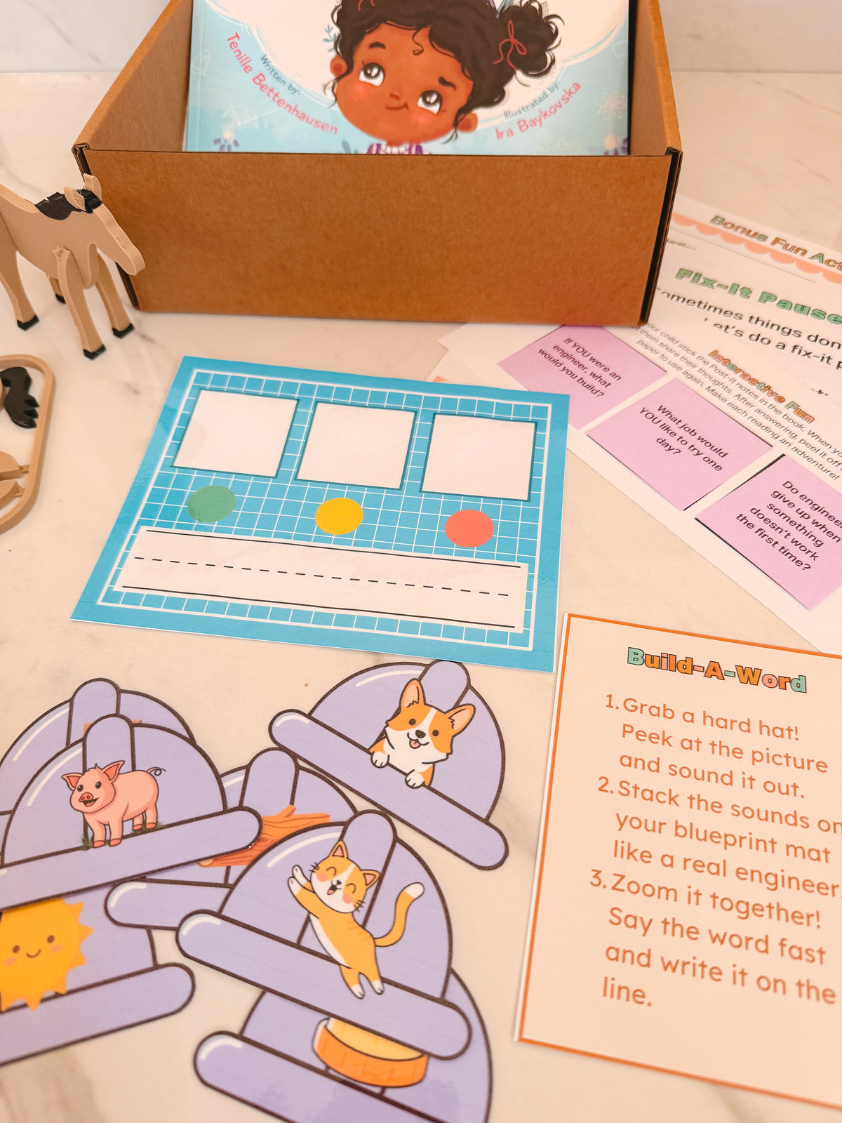 Educational children's toys and materials on a table, including puzzles and cards.